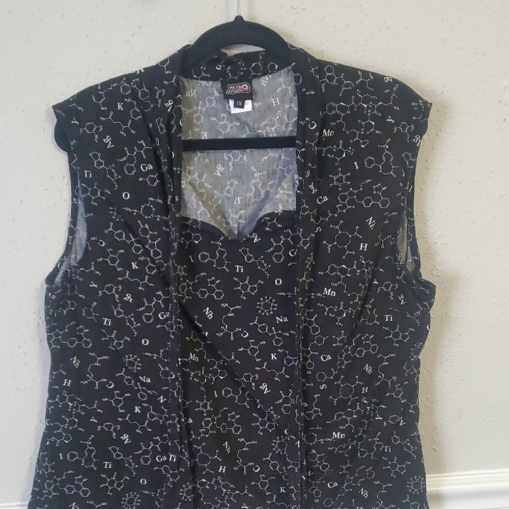 Black Sleeveless Top with White Pattern